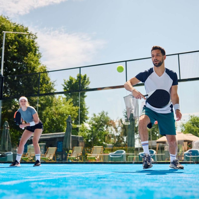 Male athlete playing mixed doubles on paddle tennis court. , Tennis & Pickleball – New